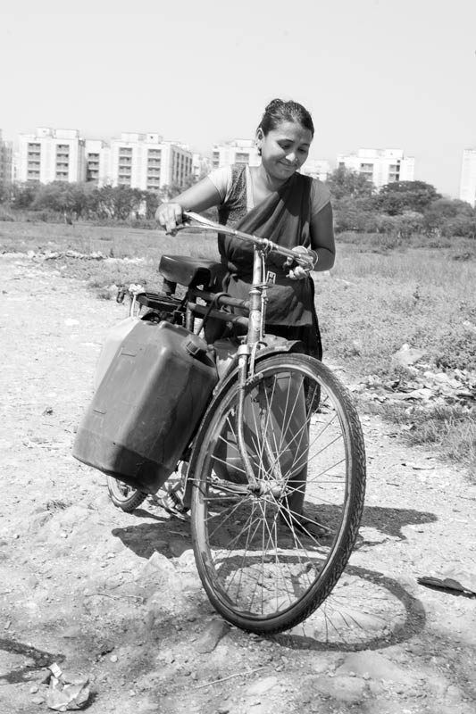 Women and Drinking Water Challenges - Employing cycle to transport extra load of drinking water from a group connection in Mumbai, Maharashtra